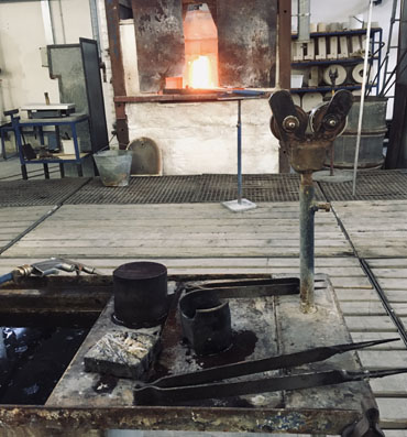 Glassmakers use wood and iron tools for hand-shaping of glass into final products.