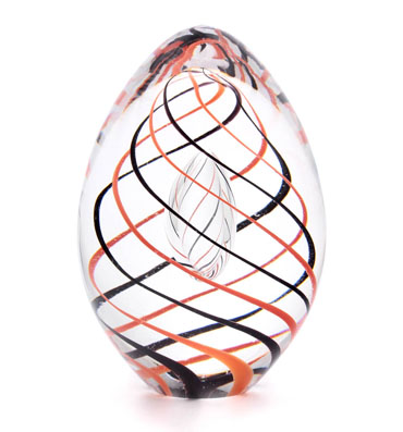 Handmade paperweight in egg shape and with inside decor.