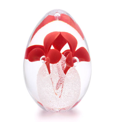 Handmade Glass Paperweight in egg shape with inside flower decor.